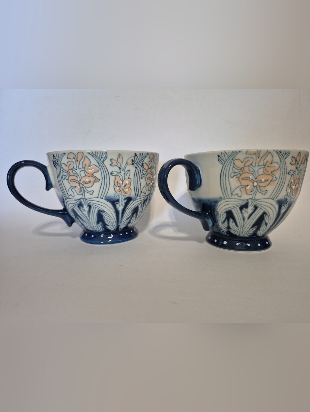 World Market Pair of Floral Ceramic Teacups in Blue and Peach
